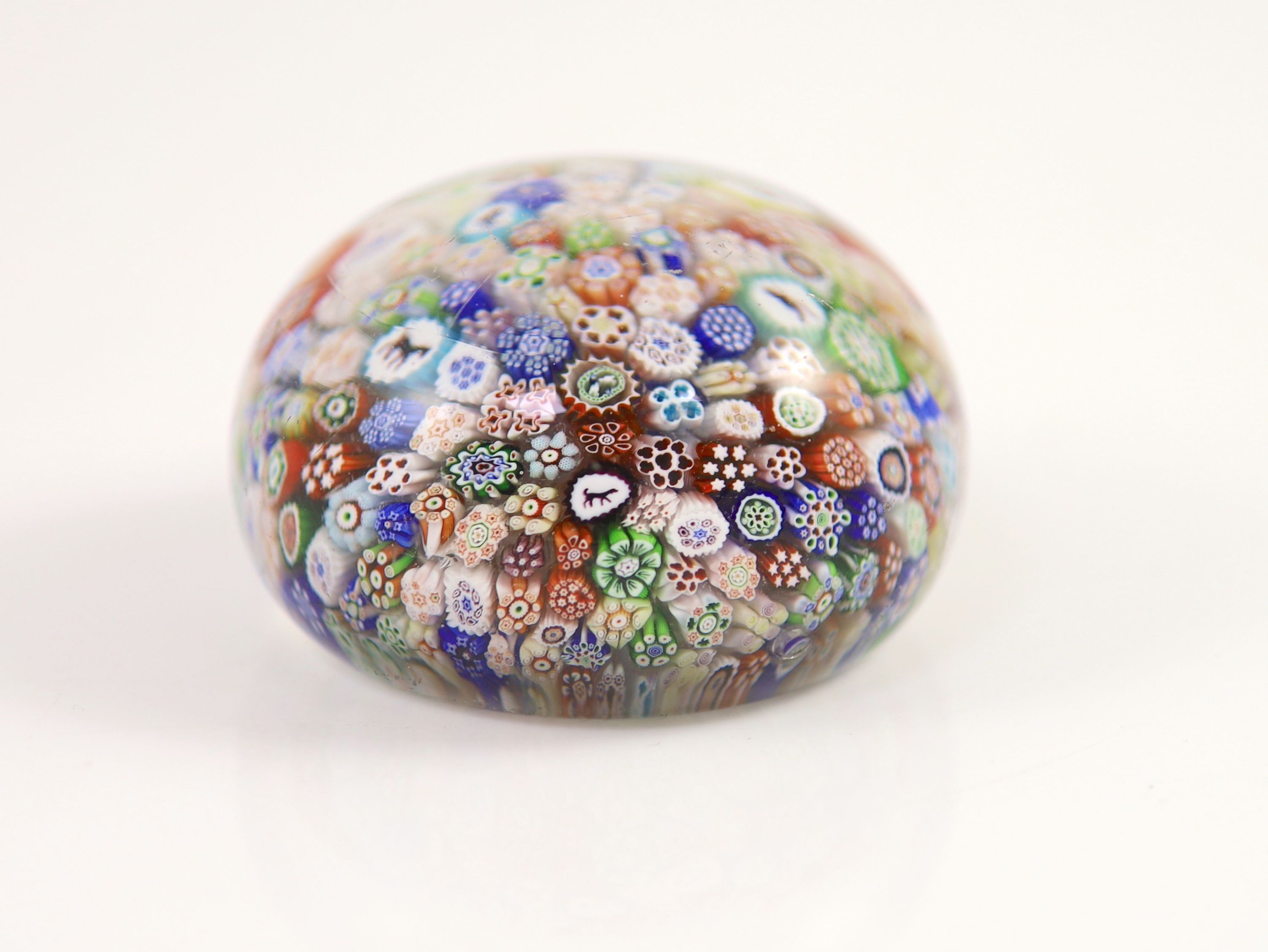 A Baccarat close packed millefiori glass paperweight, dated 1848, diameter 6.5cm